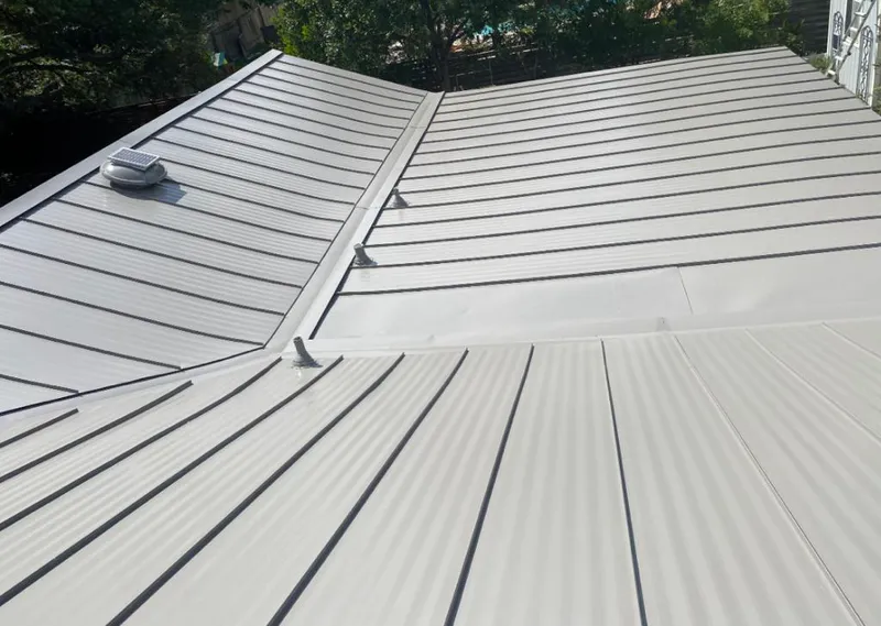 Solar attic fan installed on a metal roof for Roof Ventilation in Mukilteo
