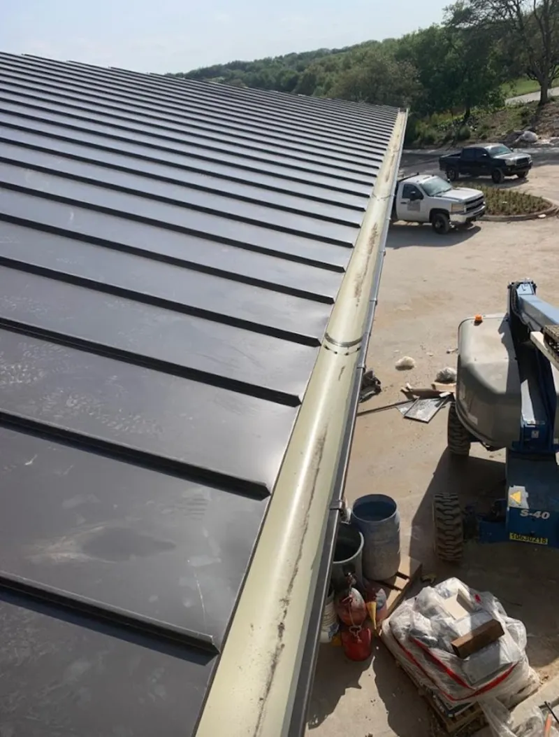 Standing seam panel and gutter detail on a metal roofing jobsite in Mukilteo